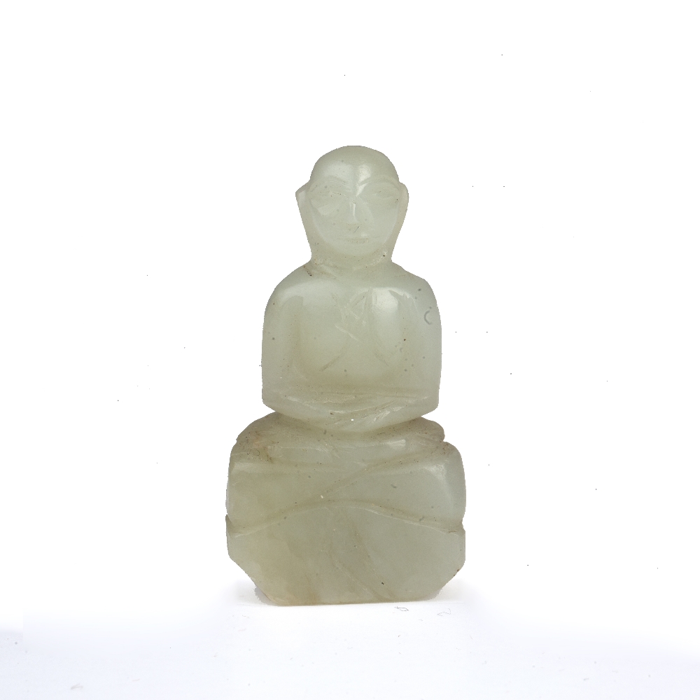 Miniature jade figure of a buddha Chinese the carved figure seated and with arms clasped, 4.25 cm