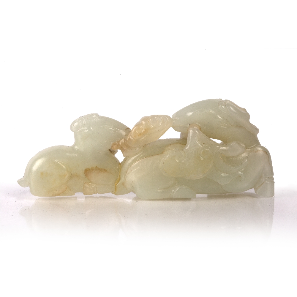 White jade pebble Chinese, 19th Century pierced and carved as a reclining deer and young, both