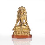 Miniature gilt bronze figure of Avalokiteshvara Chinese, late 18th Century on a double lotus base,