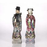 Pair of porcelain figures Chinese, 19th/20th Century depicting male and female officials, dressed in