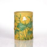 Yellow glazed brushpot Chinese, 19th Century the exterior with moulded decoration depicting