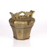 Engraved octagonal brass wine pot Chinese, early 20th Century with panels of auspicious symbols