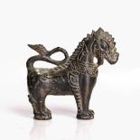 Bronze figure of a beast Burmese cast standing upright, with its tail curved 9cm high Condition: