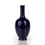 Dark blue glazed bottle vase Chinese, 19th Century with a globular body and thin long neck, 28cm