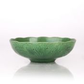 Incised green glazed bowl Chinese, 19th Century the exterior with incised decorated flowers, with
