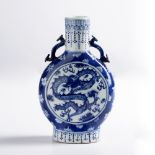 Blue and white moonflask Chinese, 19th century decorated to the centre with a four clawed dragon