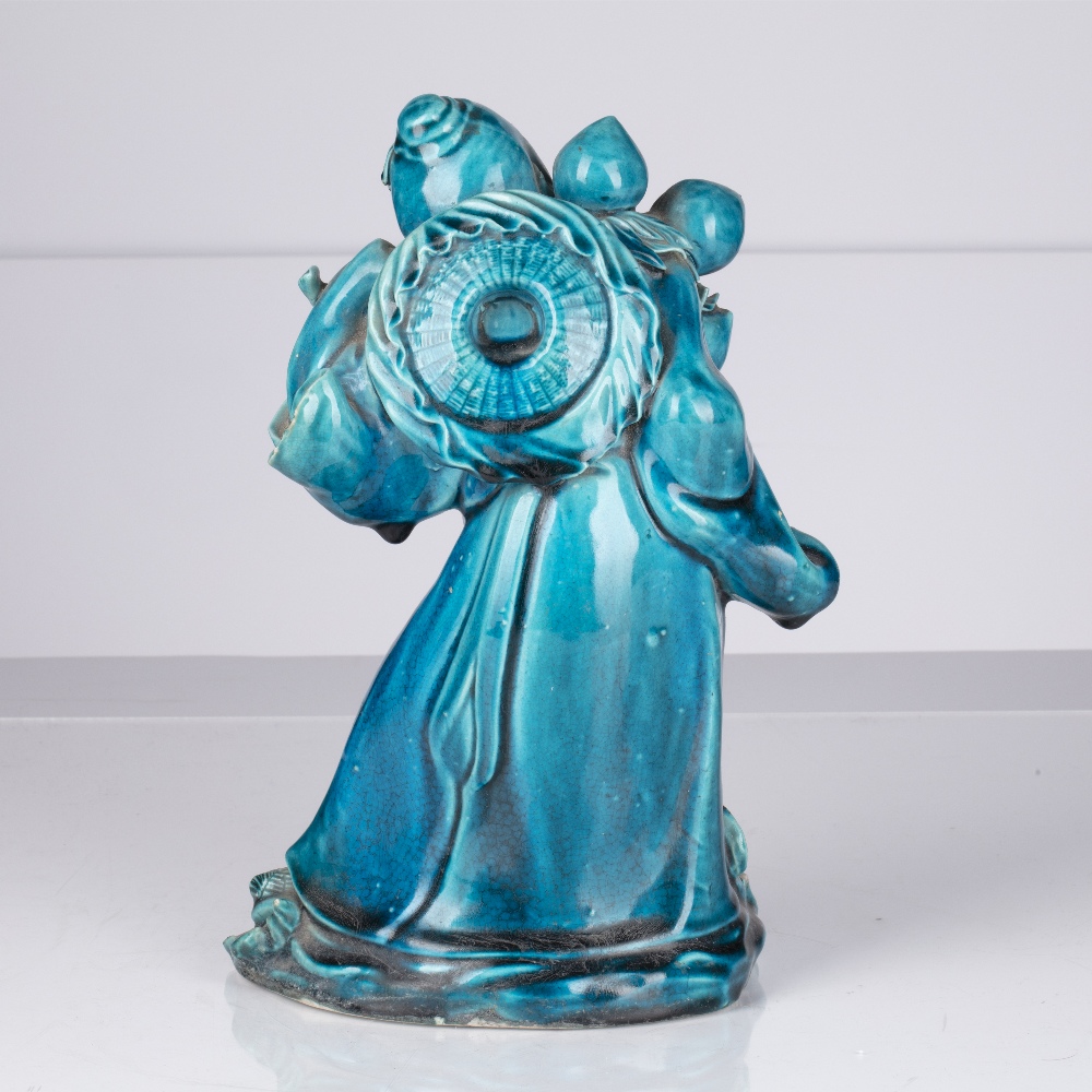 Turquoise glazed Lohan Chinese, 18th/19th Century the slightly stooped figure holding a peach in his - Image 2 of 3