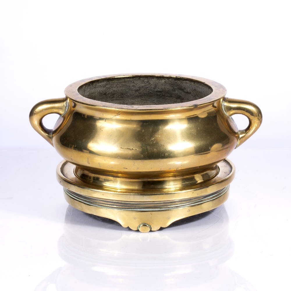 Bronze censer and stand Chinese, 17th/18th Century on a circular en-suite base, the squat bulbous