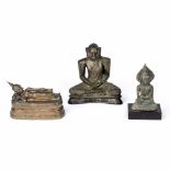 Three bronze models of Buddha South East Asian, 16th/17th Century and later two cast cross legged,