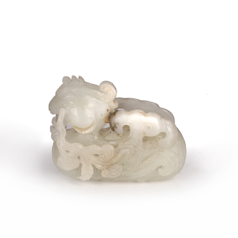 Jade carving of a phoenix Chinese carved in a recumbent position grasping a branch in the beak,