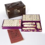 Bone and bamboo mahjong set Chinese in a leather case, 19cm wide Condition: worn and scratched and