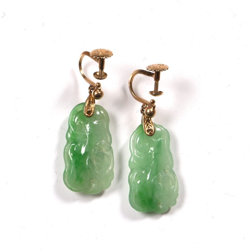 Pair of jade earrings Chinese carved as an animals, suspended by a gold metal backing stamped 18k, - Image 2 of 2