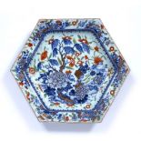 Jingdezhen hexagonal dish Chinese, 19th Century painted with peonies and 'antiques' beneath a