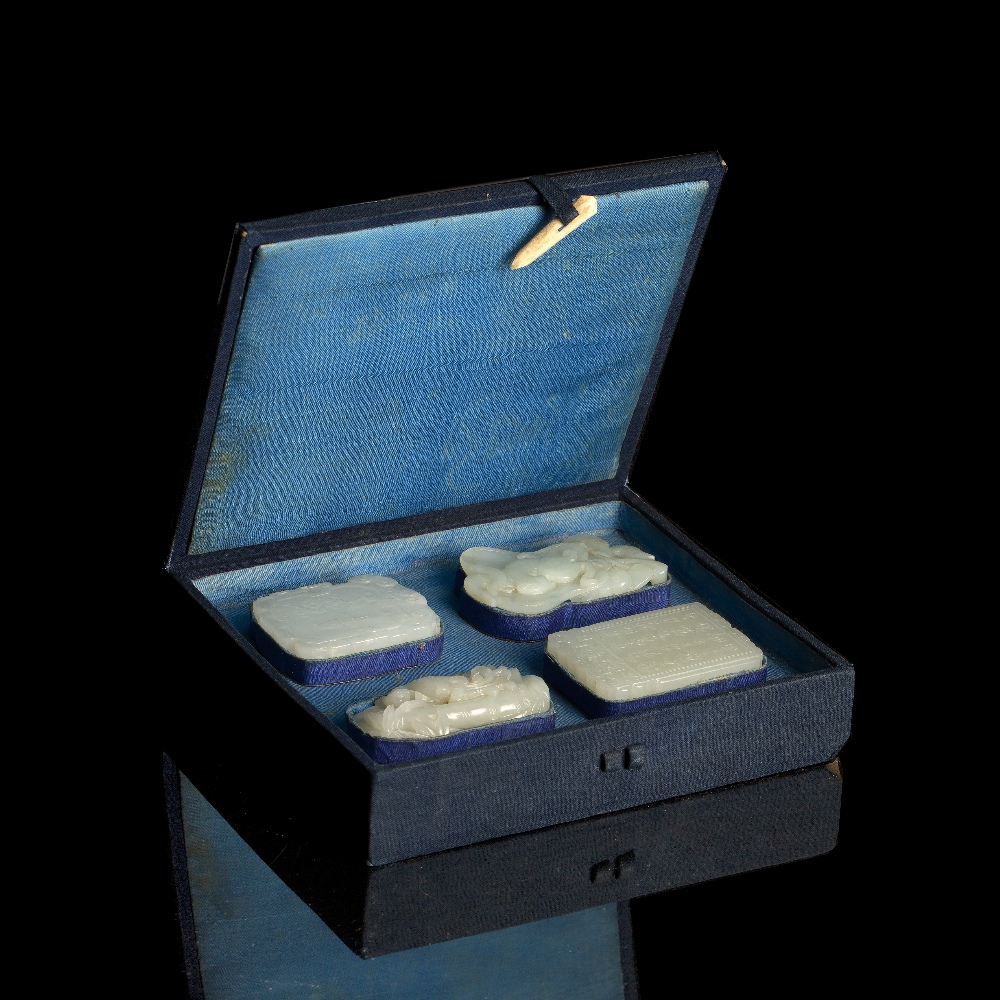 Collection of four white jade pendants Chinese, 18th Century mounted in a black and blue fitted - Image 2 of 2