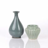 Celadon fluted brush holder Chinese, with cracklure to the glaze, 10.5cm high and a Ming style