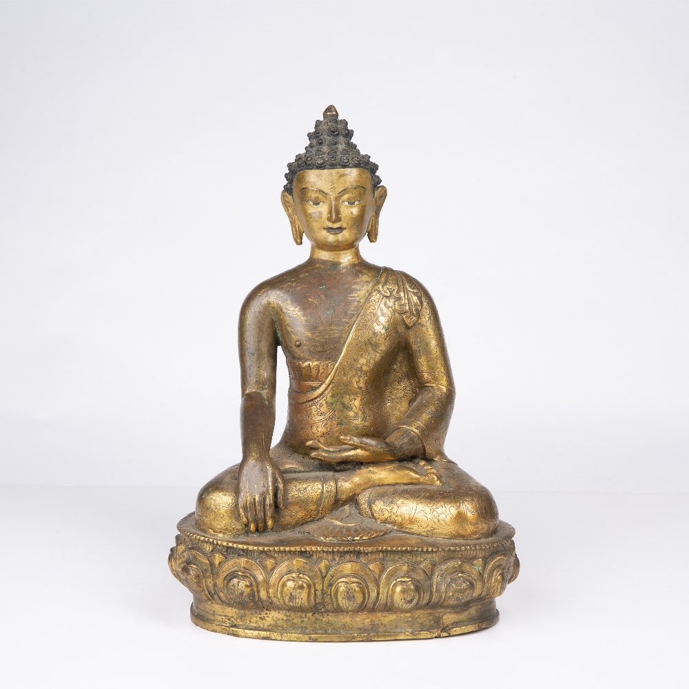 Gilt bronze model of Vajarasana Tibetan, 18th/19th Century the seated figure with engraved foliate