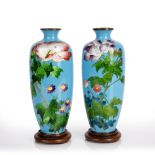 Pair of Ginbari enamel vases Japanese, Meiji period each of blue ground decorated with flowers,