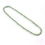 Jade necklace Chinese consisting of seventy seven apple green coloured beads Condition: general