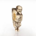 Ivory netsuke of a standing smiling farmer Japanese, 19th Century Kyoto School with hands within his