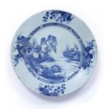 Blue and white charger Chinese, 18th Century decorated to the centre with a river landscape
