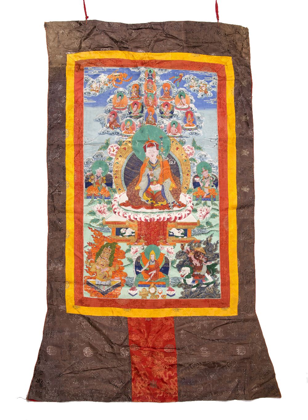 Two Thangkas Tibetan 20th Century one painted with Padmasambhava and his attendants, 89cm x 60cm and