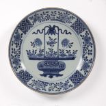 Blue and white charger Chinese, circa 1800 the centre depicting a bronze object containing flowering