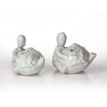 Pair of Dehua water droppers Chinese, 17th Century modelled as boys holding a peach, 9cm across (