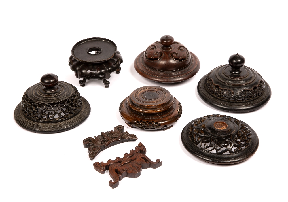 Group of carved wooden stands and covers Chinese including four hardwood covers, two stands and