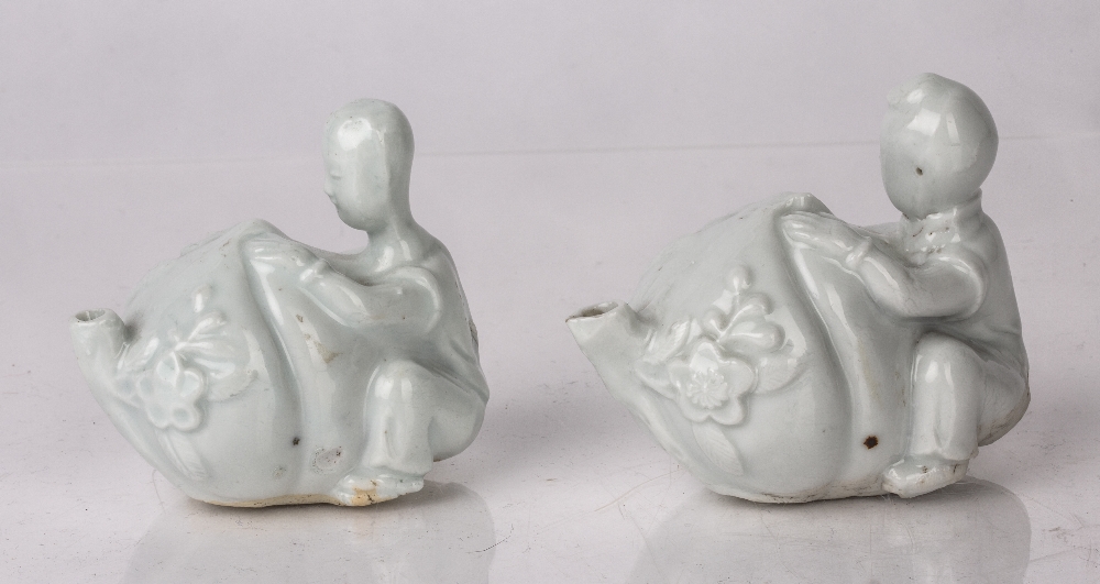 Pair of Dehua water droppers Chinese, 17th Century modelled as boys holding a peach, 9cm across ( - Image 2 of 3