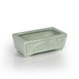 Celadon rectangular jardiniere Chinese each side with moulded decoration depicting flowering trees