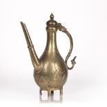 Mughal brass ewer Indian, 18th Century with a straight spout and shaped scroll handle, decorated