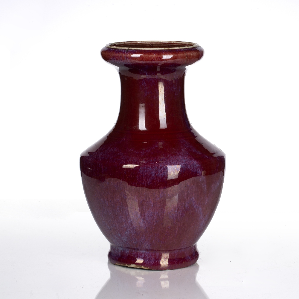 Flambe glazed vase Chinese, 18th Century covered in a rich strawberry-red glaze, with a flared neck,