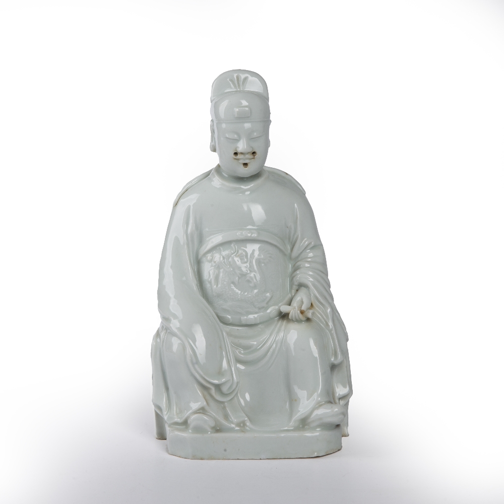 Blanc de chine seated scholar Chinese, 18th/19th Century the seated figure holding a scroll in his