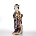 Standing Arita model geisha Japanese, late 19th Century the traditionally robed figure holding a