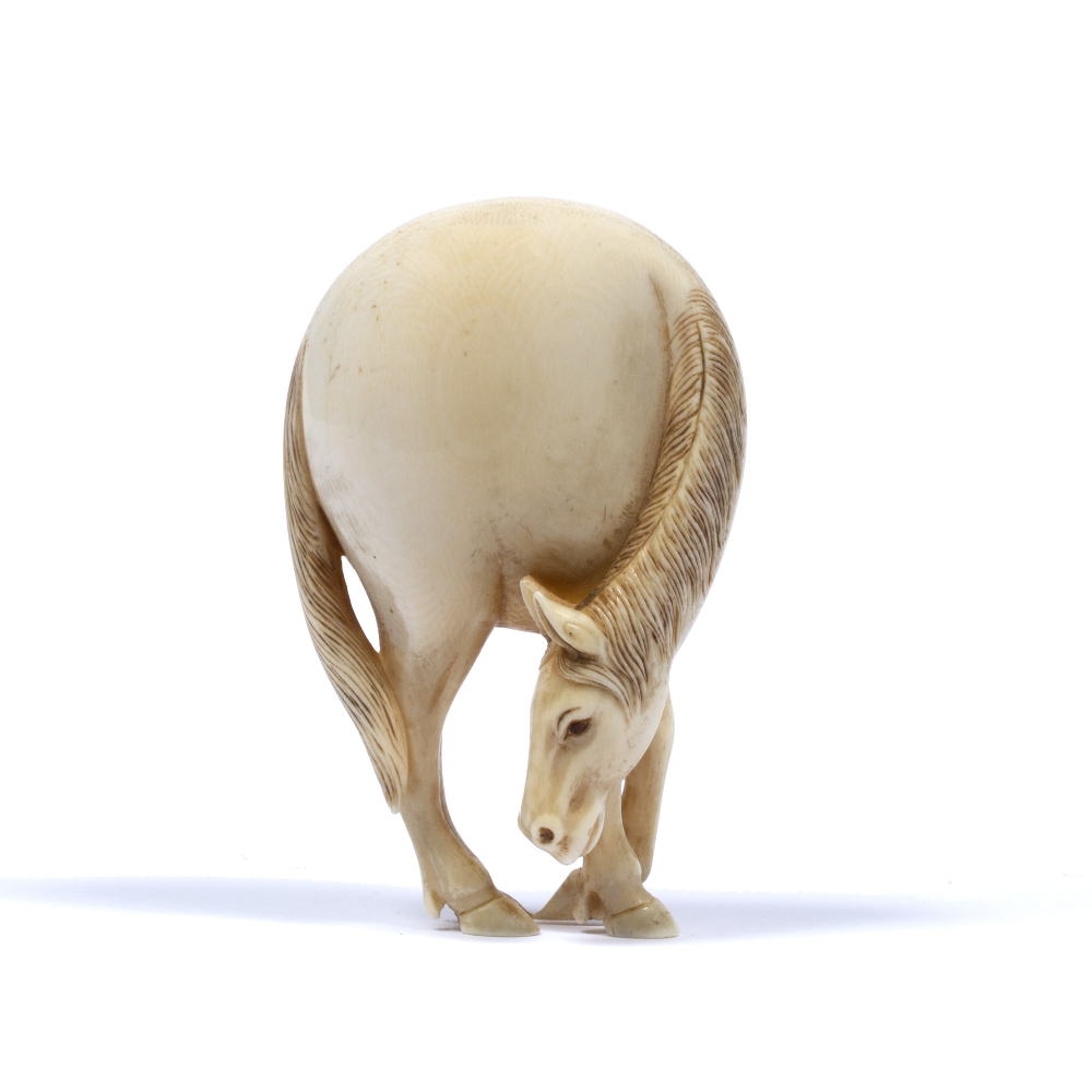 Ivory netsuke of a horse Japanese, 19th Century in the 18th Century style, 9cm high