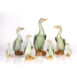 Graduated group of celadon porcelain model ducks Chinese, 20th Century largest 31cm, smallest