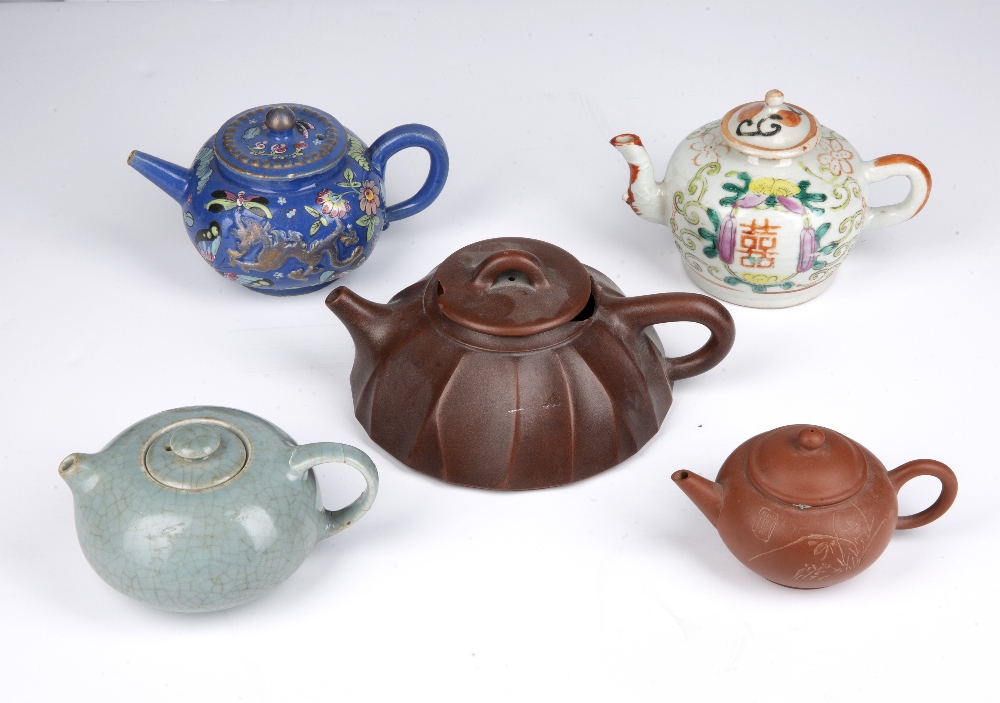 Group of five teapots Chinese to include two Yixing examples, two ceramics and a celadon teapot (