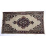 Miniature Bijar rug North West Persia of ivory ground, with foliate medallion, 117cm x 63cm