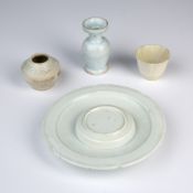 Four Qingbai porcelain items Chinese, Song/Yuan dynasty comprising of a dish with a raised centre