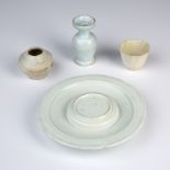 Four Qingbai porcelain items Chinese, Song/Yuan dynasty comprising of a dish with a raised centre