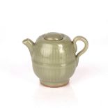 Celadon lidded teapot Chinese, Yuan / Ming dynasty with a lobed rim, 9.5cm high Condition: lid has a