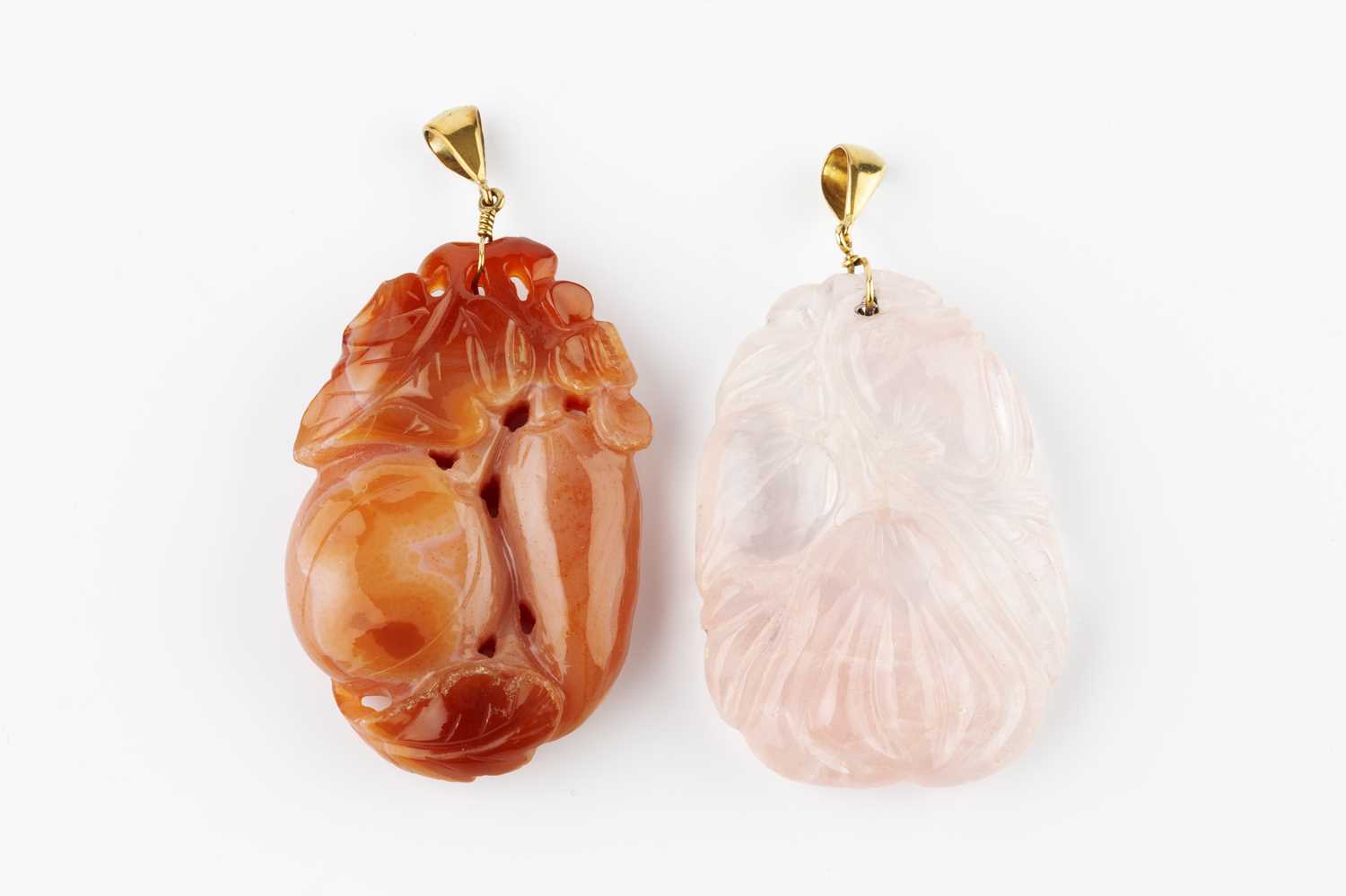 Two hardstone pendants, comprising a rose quartz pendant and a cornelian pendant, each pierced and