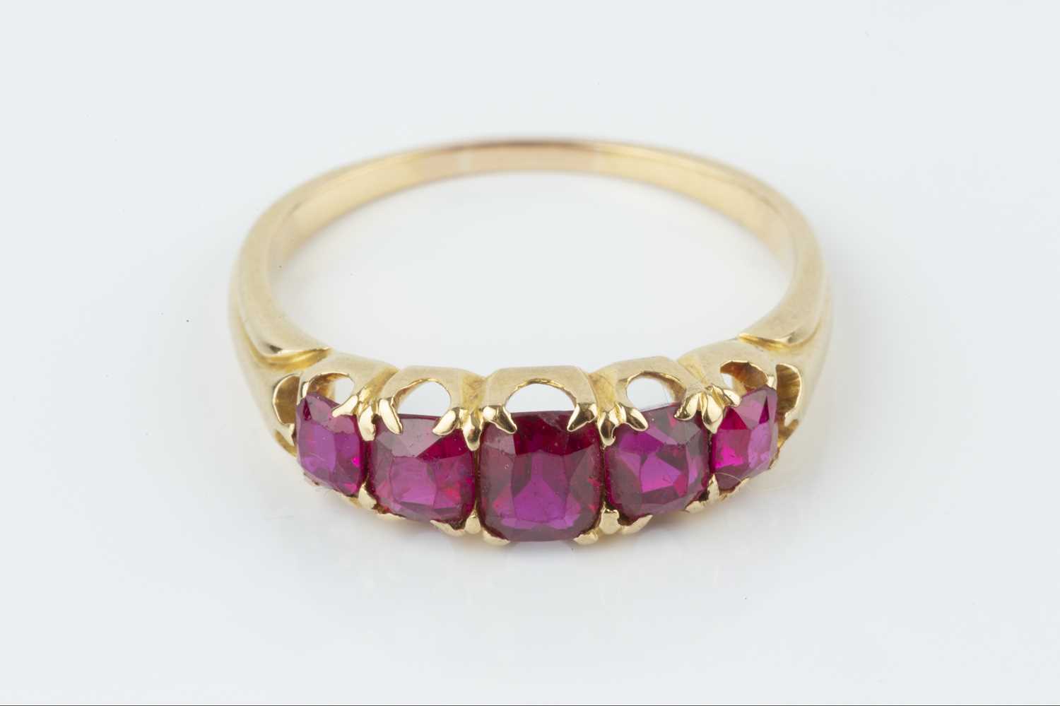 A ruby five stone ring, the graduated cushion-shaped mixed-cut rubies in fancy claw setting, - Image 2 of 3