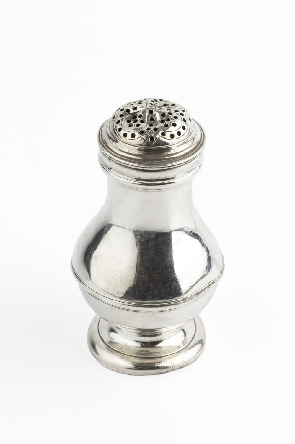 A George II silver pepper castor, of baluster form, with girdled body and pierced cover, by