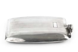 An American silver hip flask, of slightly curved rectangular design, with reeded decoration, and