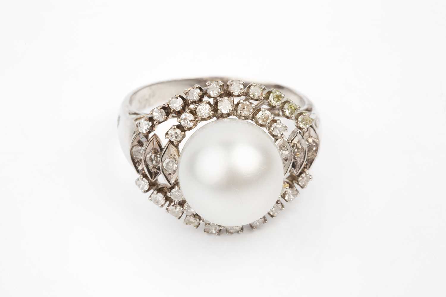 A cultured pearl and diamond ring, the cultured pearl measuring approximately 11mm diameter,