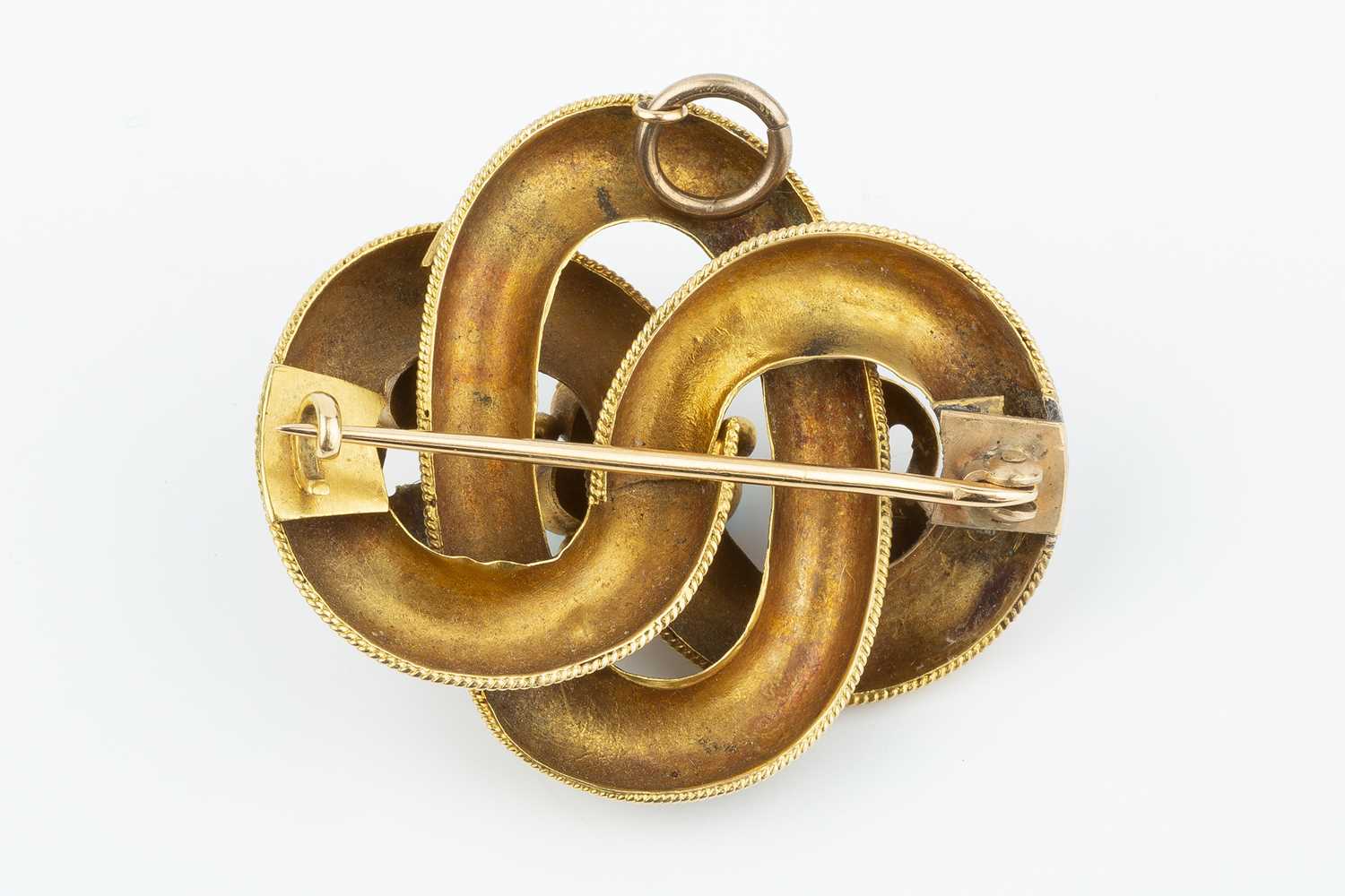 A Victorian panel brooch/pendant, designed as an entwined knot, applied with ropetwist wirework - Image 3 of 4