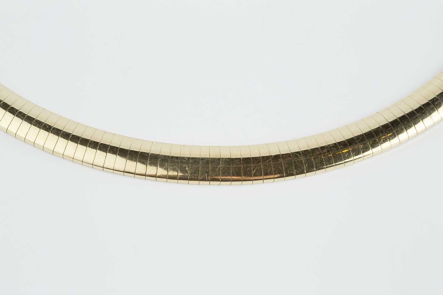 A yellow precious metal collar necklace, of gas-pipe design, stamped '585', length approximately - Image 3 of 3