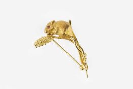 An 18ct gold brooch by Harriet Glen, modelled as a harvest mouse on a sheaf of corn, with circular-