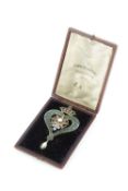 Of Scottish interest: A Victorian half pearl and enamel brooch, of crowned heart design, with